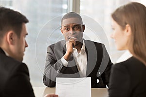 Nervous worried unhired african-american job applicant waiting f photo