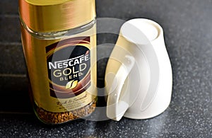 Nescafe Gold Blend instant coffee and cup