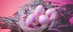 nest of easter eggs on pink background with green leaves