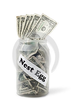 Nest Egg money bills in cash jar