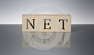 NET concept, wooden word block on the grey background