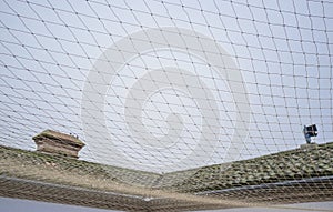 Net covering courtyard area to protect buiding keeping out pest birds