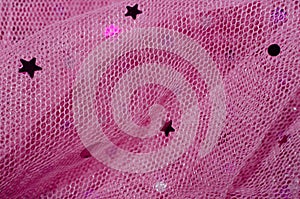Net Fabric with embellishment of star and circle. Pink colorful netting material.