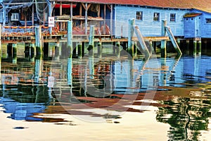 A net shed reflects in the Puget Sound at Gig Harbor