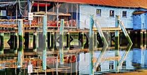 A net shed reflects in the Puget Sound at Gig Harbor