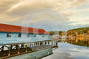 A net shed reflects in the Puget Sound at Gig Harbor photo