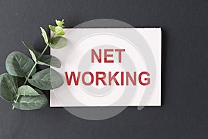 Net Working text on notepad with keyboard on table