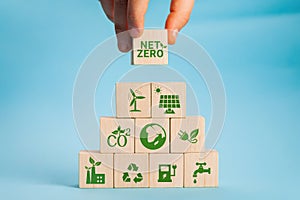 Net zero and carbon neutral concept. Net zero greenhouse gas emissions target. Climate neutral long term strategy. Hand photo