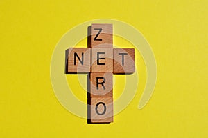 Net Zero, words in a cross, isolated on yellow with copy space