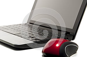 Netbook and a red mouse