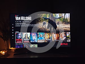 Netflix app on tv screen playing and the `Van Helsing` series logo behind