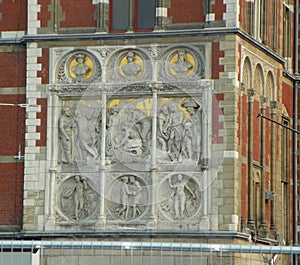 Netherlands, Amsterdam, Stationsplein, Amsterdam Centraal Station, bas-relief on the facade of the building photo