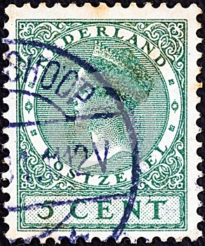 NETHERLANDS - CIRCA 1924: A stamp printed in the Netherlands shows Queen Wilhelmina, circa 1924.