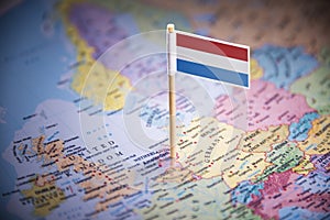 Netherlands marked with a flag on the map