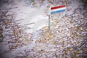 Netherlands marked with a flag on the map