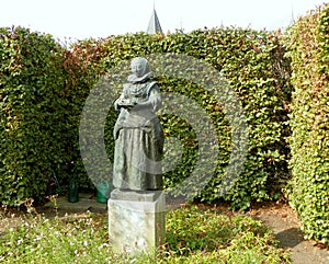 Netherlands, Muiden Castle, Historic gardens, statue Tesseltje, representing Maria Tesselschade (poet from Amsterdam