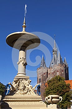 Ancient fountain and city gate in Zwolle photo