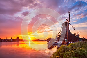 Windmills at Zaanse Schans in Holland on sunset. Zaandam, Nether photo