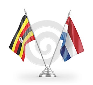 Netherlands and Uganda table flags isolated on white 3D rendering