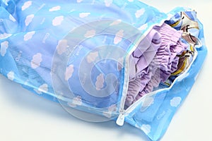 Nets laundry bag, for washing clothes in washing machine on white background.