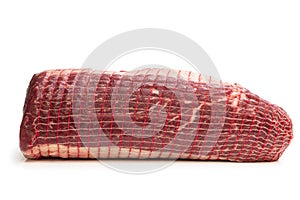 Netted pack of raw meat package isolated on white background