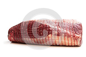 Netted pack of raw meat package isolated on white background