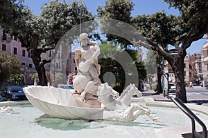 Nettuno, Italy â10 June 2018: Marble Fountain of Neptune (Fontana del dio Nettuno). Statue of Poseidon