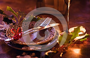 Netural style christmas dinner table setting: simple wooden table with silverware photo