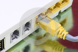Network cable connected to internet router on metal table