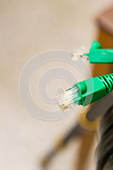 Network cable green on a blurred background peripherals for computer design base