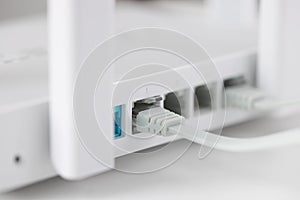 Network cable is plugged into socket of access point closeup