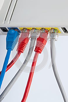 Network cables connected to the router. Network Communications