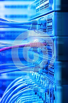 Network cables and hub closeup with fiber optical