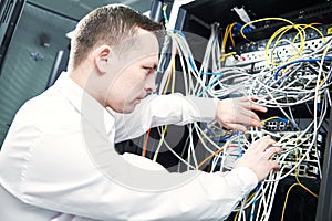 Network engineer administrating in server room