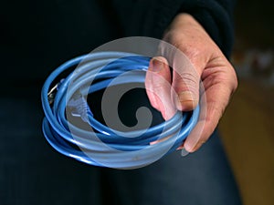 Network engineer holding Ethernet cables close up shot