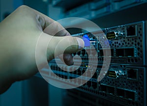Network engineer plug lan cable to ethernet switch