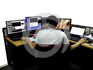 Network engineer woking with multiple monitors