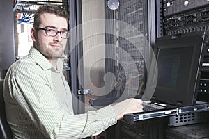 Network engineer working in server room