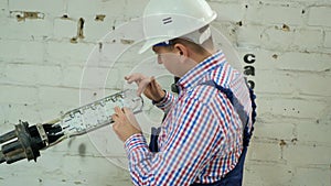 A network engineer works with optical fiber equipment