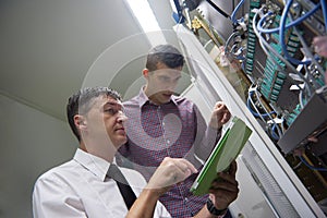 Network engineers in server room