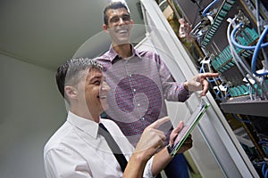 Network engineers in server room