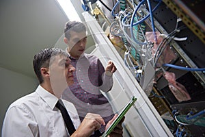 Network engineers in server room