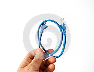 Network ethernet cable blue in male hand