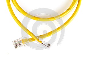 Network ethernet cable with RJ45 connectors isolated on white background. UTP Cable or LAN Cable. yellow color on white background