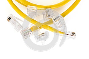 Network ethernet cable with RJ45 connectors isolated on white background. UTP Cable or LAN Cable. yellow color on white background