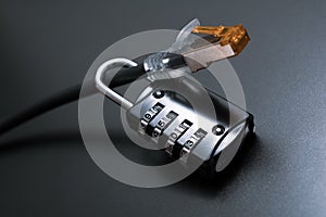 Network Ethernet Cable Secured By A Combination Lock - Internet Security Concept