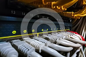 Network ethernet cables connect to switch and patch panel