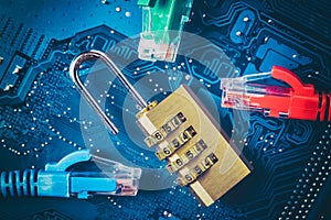 Network ethernet cables near opened padlock on computer motherboard. Internet data privacy information security concept. Blue tone