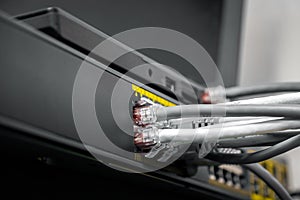 Network Gigabit Smart PoE Switch with connected cables photo