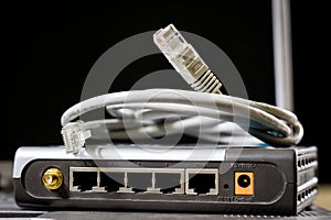 Network hub and rj45 cables on the stage. Computer accessories u